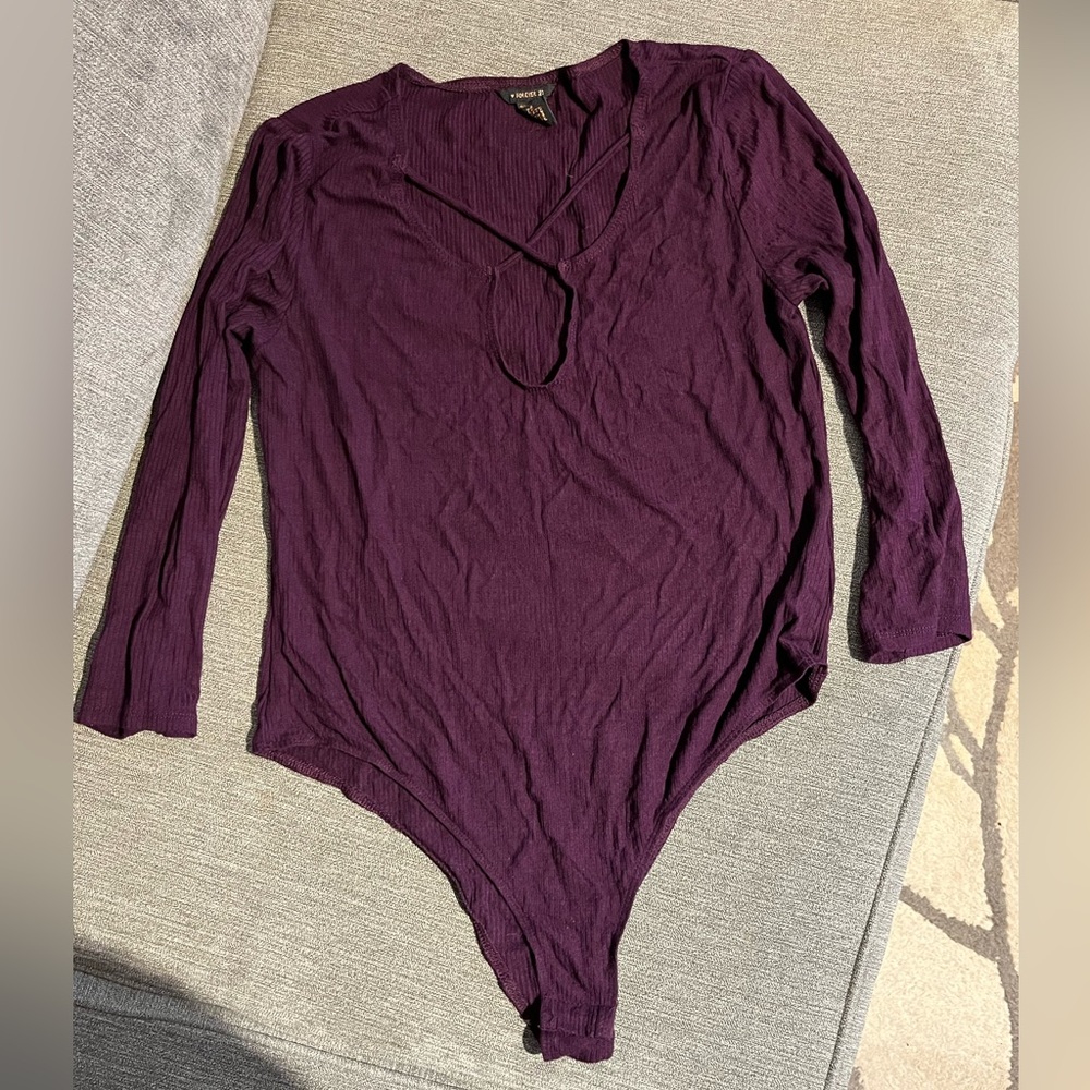Purple Forever 21 unitard with cross detail on front. Size Large.